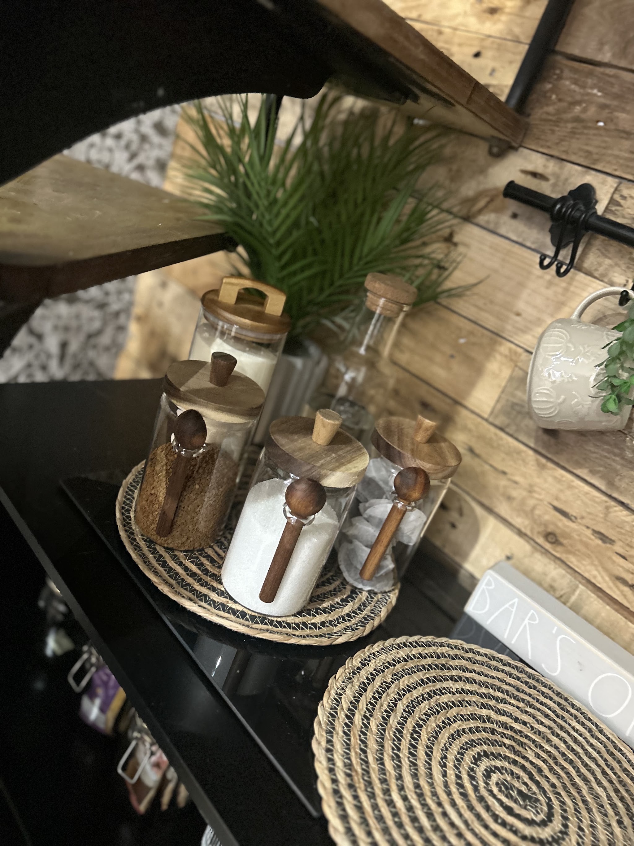 Glass jars with wooden scoops on the salon counter