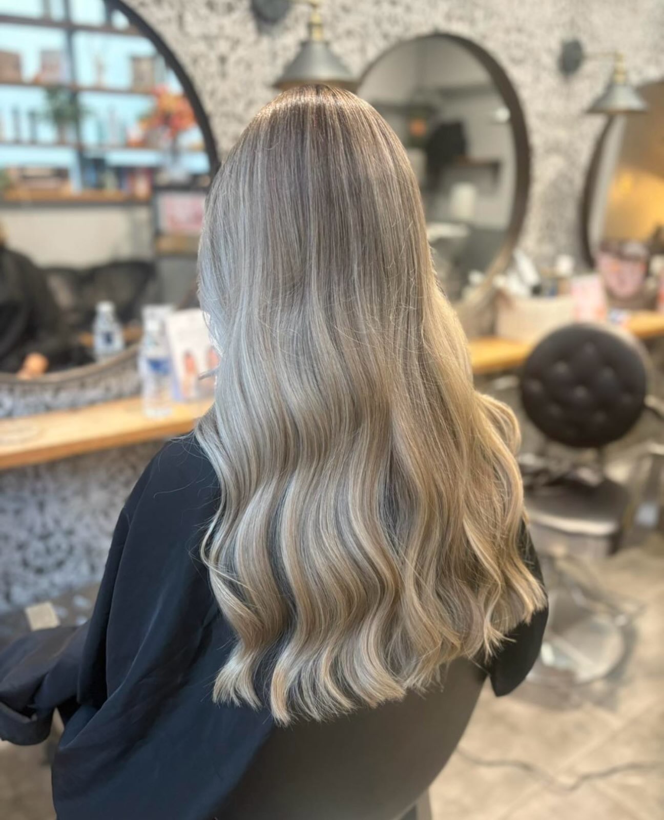 Long ash blonde balayage in the salon